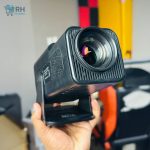 HY320 Projector displaying on large wall screen